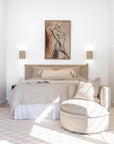 Toro Occasional Chair styled in a tranquil bedroom setting with neutral-toned bedding, textured cushions, and soft natural light for a serene and inviting look