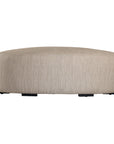 Curved upholstered ottoman with natural textured fabric and subtle black feet, ideal for contemporary living spaces