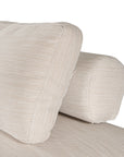 Natural textured outdoor fabric one seater lounge with plush cushion, offering luxurious and relaxing seating for contemporary interiors.