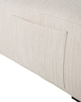 Natural textured outdoor fabric one seater lounge with plush cushion, offering luxurious and relaxing seating for contemporary interiors.