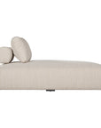 Natural textured outdoor fabric chaise lounge with plush cushion, offering luxurious and relaxing seating for contemporary interiors.