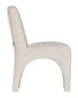 Contemporary arched dining chair upholstered in natural fabric, featuring sculptural curves and modern silhouette for refined dining spaces