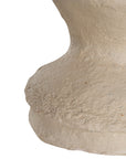 Sculptural table lamp with a cream textured paper mache base and neutral linen shade, adding organic elegance to any space