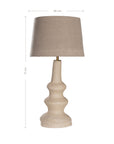 Sculptural table lamp with a cream textured paper mache base and neutral linen shade, adding organic elegance to any space