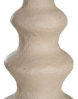 Sculptural table lamp with a cream textured paper mache base and neutral linen shade, adding organic elegance to any space