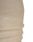 Sculptural table lamp with a cream textured paper mace base and neutral linen shade, adding organic elegance to any space