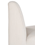 Elegant white upholstered dining chair with a modern, curved silhouette and a seamless design, perfect for contemporary and minimalist outdoors