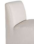 Elegant white upholstered dining chair with a modern, curved silhouette and a seamless design, perfect for contemporary and minimalist outdoors
