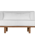 A contemporary armless sofa with plush white cushions and a sturdy natural teak wood frame. This minimalist lounge piece offers versatile seating, perfect for modern living spaces or outdoor settings