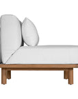 A contemporary armless sofa with plush white cushions and a sturdy natural teak wood frame. This minimalist lounge piece offers versatile seating, perfect for modern living spaces or outdoor settings