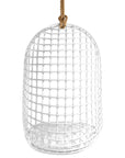 A stylish white hanging chair with an open-weave design, suspended by a natural rope and featuring a plush white cushion for ultimate relaxation