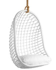 A stylish white hanging chair with an open-weave design, suspended by a natural rope and featuring a plush white cushion for ultimate relaxation