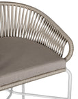 White natural outdoor bar chair featuring a woven rope backrest and sleek metal legs, designed for modern alfresco dining and stylish patio settings