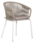 White and natiral outdoor dining chair featuring a woven rope backrest and sleek metal legs, designed for modern alfresco dining and stylish patio settings
