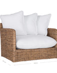 A contemporary white natural woven sofa with plush, generously filled cushions, offering both comfort and style for a refined coastal or modern living space.