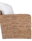 A contemporary white natural woven sofa with plush, generously filled cushions, offering both comfort and style for a refined coastal or modern living space.