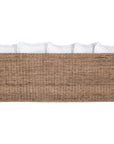 A contemporary white natural woven sofa with plush, generously filled cushions, offering both comfort and style for a refined coastal or modern living space.