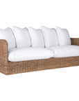 A contemporary white natural woven sofa with plush, generously filled cushions, offering both comfort and style for a refined coastal or modern living space.