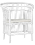 A beautifully crafted white rattan armchair with an open-weave design and a white cushioned seat, perfect for adding a relaxed coastal touch to any space