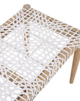 Natural teak and leather bench with a woven seat and solid wooden frame, showcasing artisanal craftsmanship and organic textures