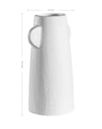 White sculptural vase with unique handles, adding a touch of contemporary elegance to home decor