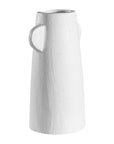 White sculptural vase with unique handles, adding a touch of contemporary elegance to home decor