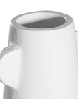 White sculptural vase with unique handles, adding a touch of contemporary elegance to home decor