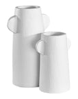 Set of white sculptural vases with unique handles, adding a touch of contemporary elegance to home decor