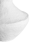 A sculptural white decorative vase with a textured finish, adding an organic, artisanal touch to modern interiors