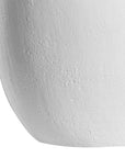 White textured vase with a modern sculptural design, perfect for minimalist decor.