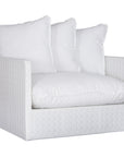 A contemporary white woven sofa with plush, generously filled cushions, offering both comfort and style for a refined coastal or modern living space.
