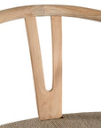 A natural timber wishbone dining chair with a handwoven rope seat, featuring an iconic curved backrest and minimalist Scandinavian-inspired design. Perfect for modern coastal and contemporary interiors, offering both style and comfort