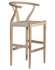 A natural timber wishbone bar stool with a handwoven rope seat, featuring a curved backrest and minimalist Scandinavian-inspired design. Crafted for both comfort and style, this versatile piece is perfect for modern coastal and contemporary interiors