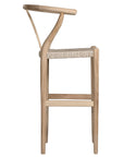 A natural timber wishbone bar stool with a handwoven rope seat, featuring a curved backrest and minimalist Scandinavian-inspired design. Crafted for both comfort and style, this versatile piece is perfect for modern coastal and contemporary interiors
