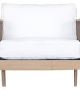 Wooden accent chair with white cushions and sleek spindle detailing, perfect for modern coastal and relaxed living spaces