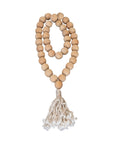 Natural wood bead garland with tassel, perfect for adding rustic charm and texture to home decor