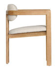 Contemporary wooden arm chair with a natural oak frame and boucle upholstered seat and backrest, designed for modern comfort and style