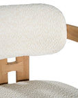 Contemporary wooden bar chair with a natural oak frame and boucle upholstered seat and backrest, designed for modern comfort and style.