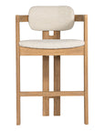 Contemporary wooden bar chair with a natural oak frame and boucle upholstered seat and backrest, designed for modern comfort and style.