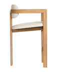 Contemporary wooden bar chair with a natural oak frame and boucle upholstered seat and backrest, designed for modern comfort and style.