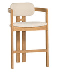 Contemporary wooden bar chair with a natural oak frame and boucle upholstered seat and backrest, designed for modern comfort and style.