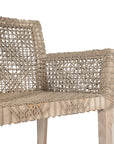 Woven rope armchair with natural teak frame, showcasing intricate handwoven craftsmanship and earthy, relaxed style