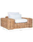 Natural wicker armchair with thick white cushions, showcasing a coastal-inspired design perfect for indoor and outdoor settings