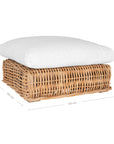 Natural wicker ottoman with thick white cushions, showcasing a coastal-inspired design perfect for indoor and outdoor settings