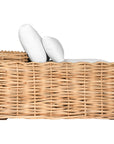 Natural wicker sofa with thick white cushion, showcasing a coastal-inspired design perfect for indoor and outdoor settings