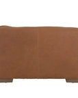 Modern leather upholstered armchair with soft, rounded cushions and light wooden legs
