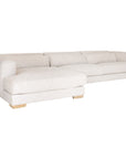 Modern white upholstered sofa with soft, rounded cushions and light wooden legs