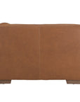 Modern leather upholstered sofa with soft, rounded cushions and light wooden legs