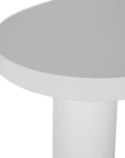 Zuburu coffee table in white concrete finish with organic curved tabletop and cylindrical pillar legs.