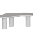 Zuburu coffee table in white concrete finish with organic curved tabletop and cylindrical pillar legs.